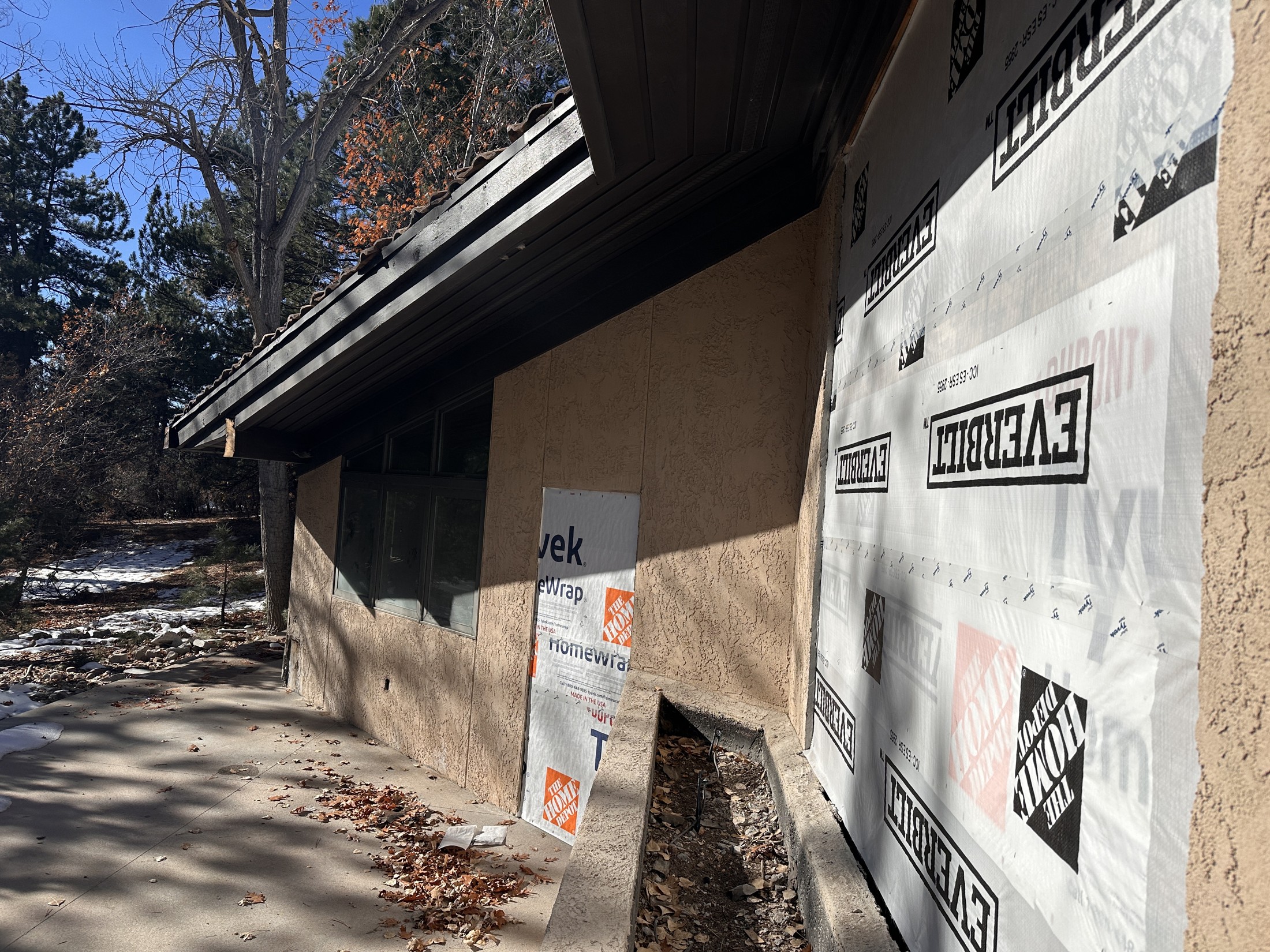 During · Trellises removed and patio reconfigured for the new dining-room connection