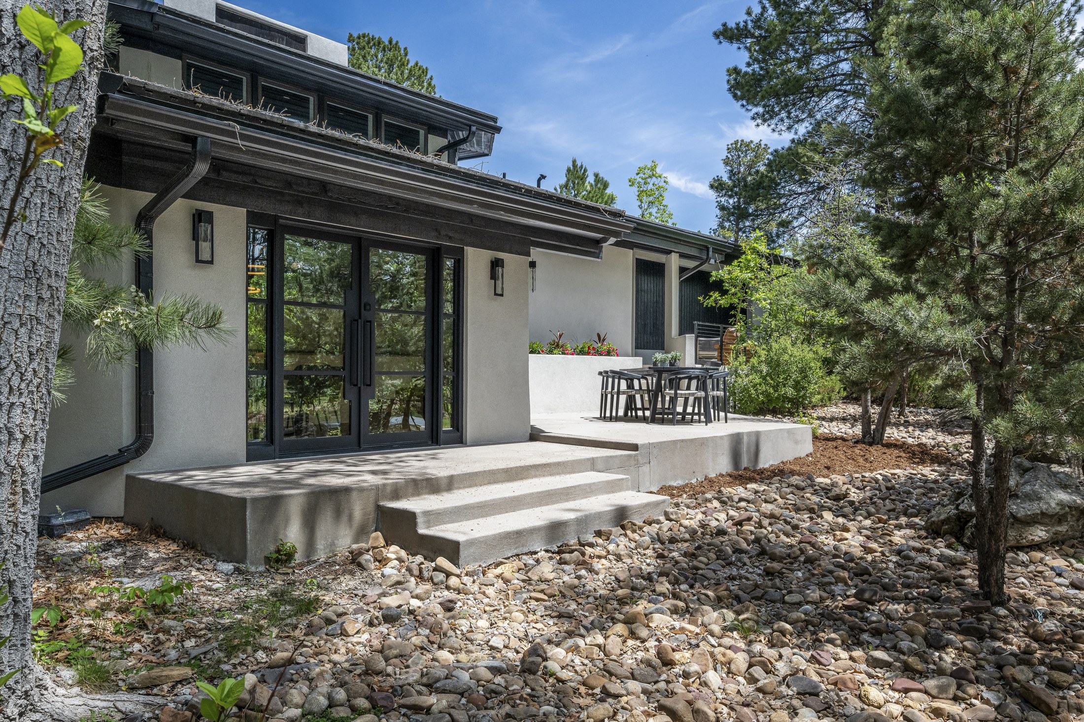 After · New dining-room doors and connection to the upper patio
